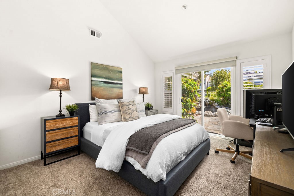 1 Centaurus, Unit 12 Irvine, CA 92603 - Photo 27 of 37 a bedroom with a bed a table and a fireplace