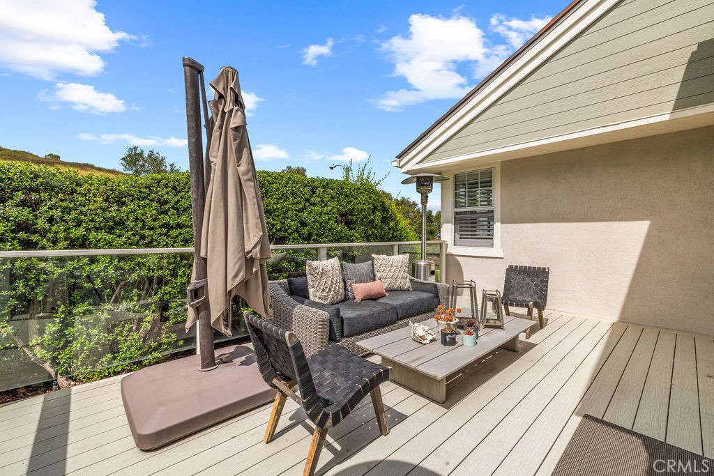 1 Centaurus, Unit 12 Irvine, CA 92603 - Photo 30 of 37 a roof deck with wooden floor and fence