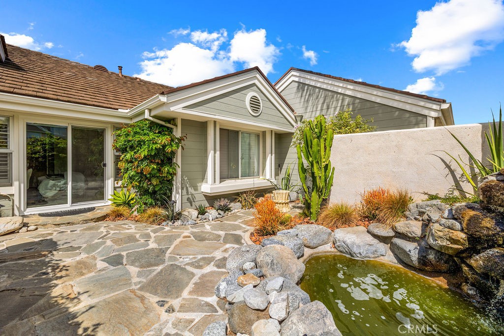 1 Centaurus, Unit 12 Irvine, CA 92603 - Photo 3 of 37 a view of a house with a yard