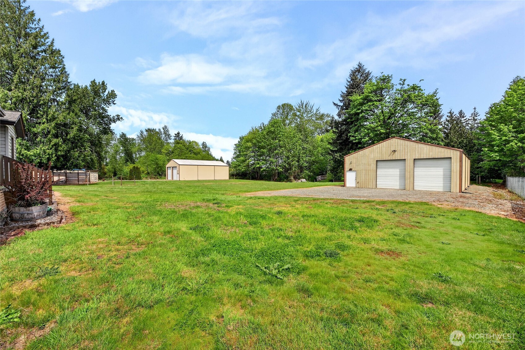 17830 116th Avenue Southeast Renton, WA 98058 - Photo 7 of 10 a backyard of a house with lots of green space and plants