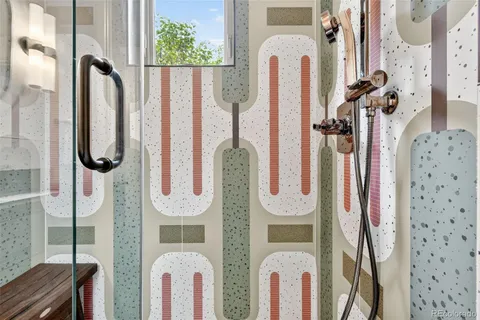 a bathroom with a tub sink and mirror