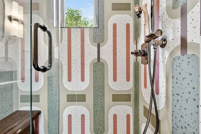 a bathroom with a tub sink and mirror