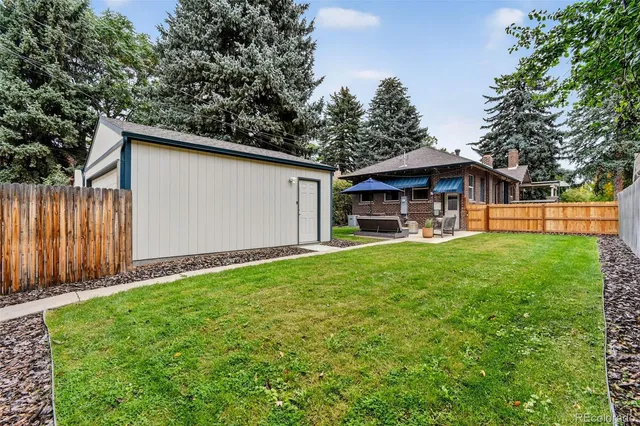 a view of a backyard with a garden and plants