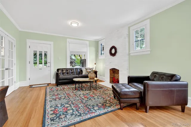 a living room with furniture rug and window