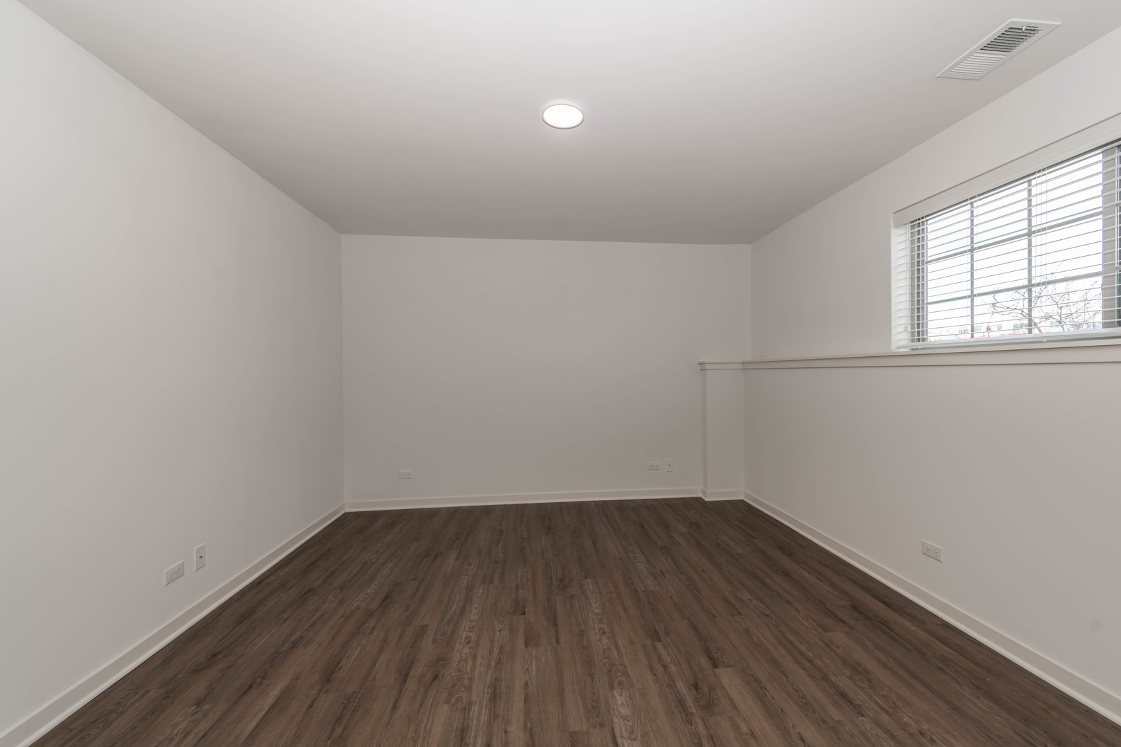 21599 West Field Court, Unit 21567 Deer Park, IL 60010 - Photo 10 of 14 a view of a room with wooden floor and window