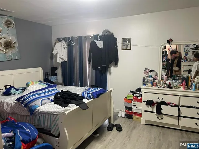 a bedroom with bed and furniture