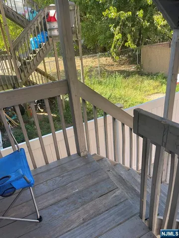 a view of balcony with wooden floor