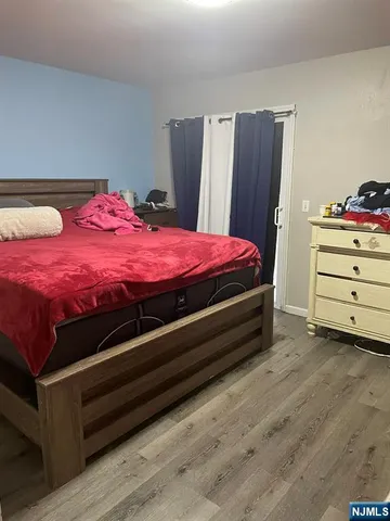 a bed room with a bed and a dresser