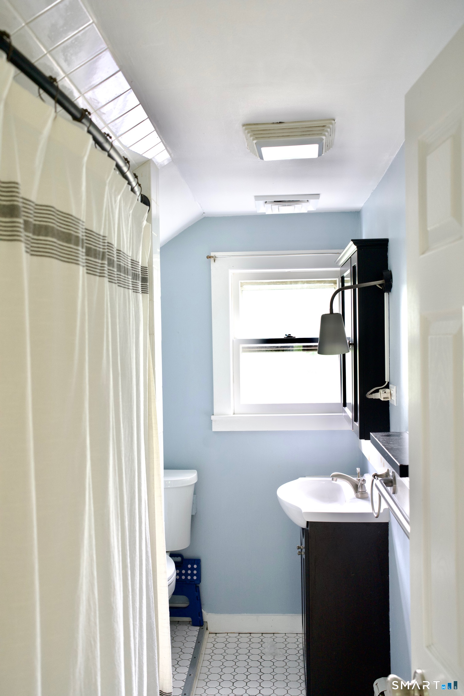 259 Peck Hill Road Woodbridge, CT 06525 - Photo 30 of 32 a bathroom with a sink and a mirror