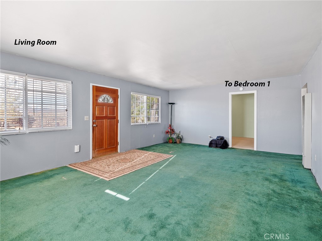 17757 Wheeler Road Helendale, CA 92342 - Photo 4 of 30 an empty room with windows and closet