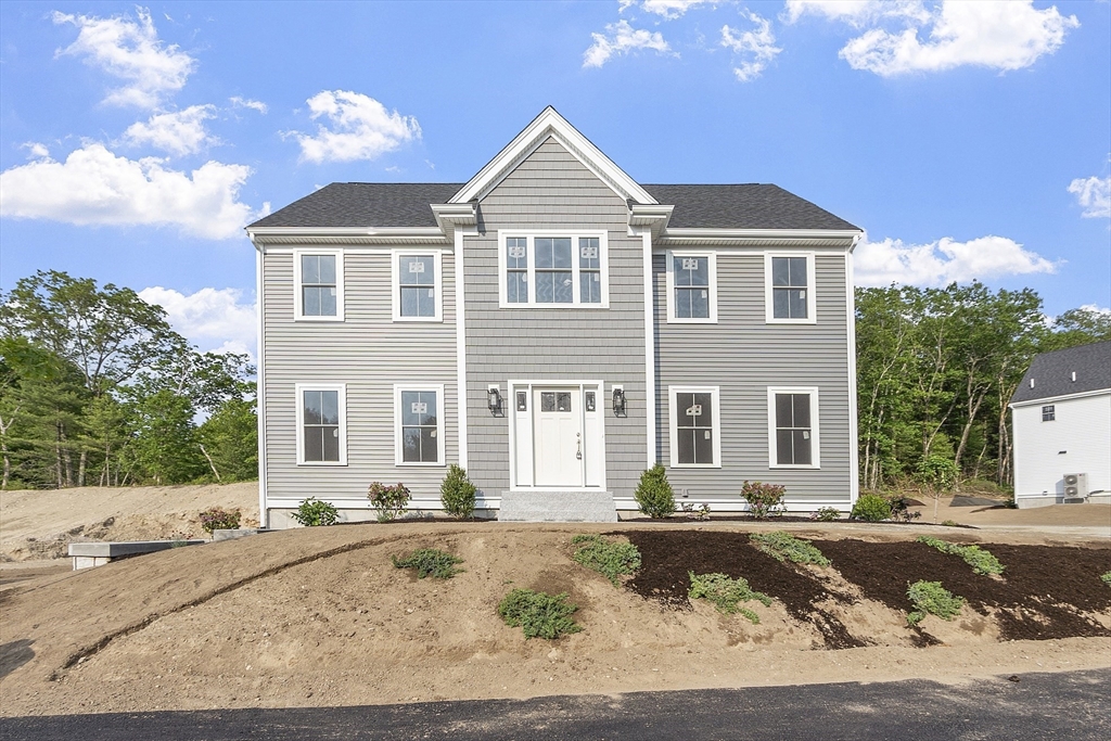22 Waites Crossing Norfolk, MA 02056 - Photo 1 of 33 a front view of a house with a yard