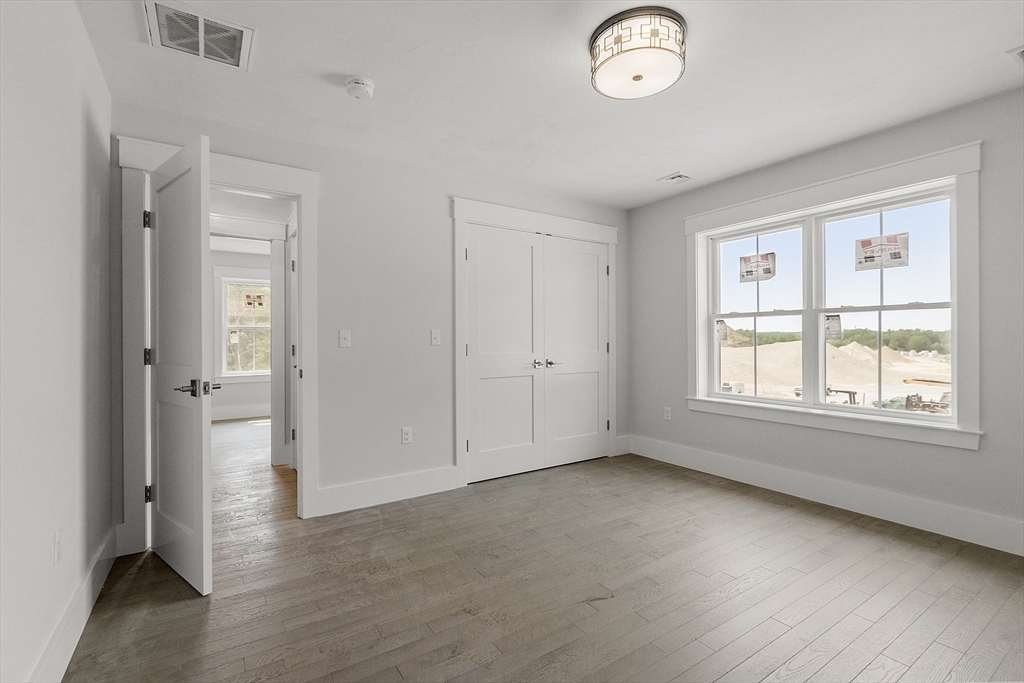 22 Waites Crossing Norfolk, MA 02056 - Photo 18 of 33 a view of an empty room with a window
