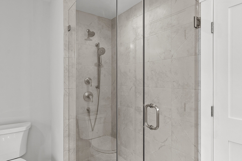 22 Waites Crossing Norfolk, MA 02056 - Photo 26 of 33 a bathroom with a shower and toilet