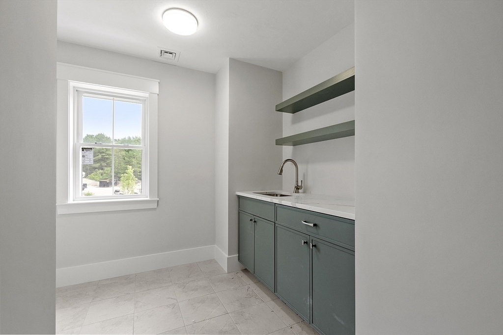 22 Waites Crossing Norfolk, MA 02056 - Photo 27 of 33 a kitchen with a sink cabinets and a window