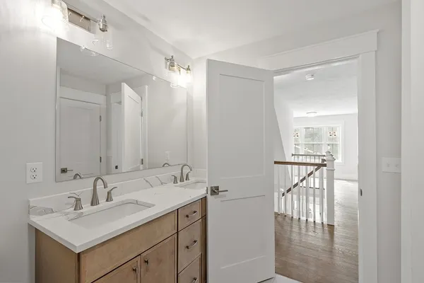a bathroom with a sink mirror and a vanity