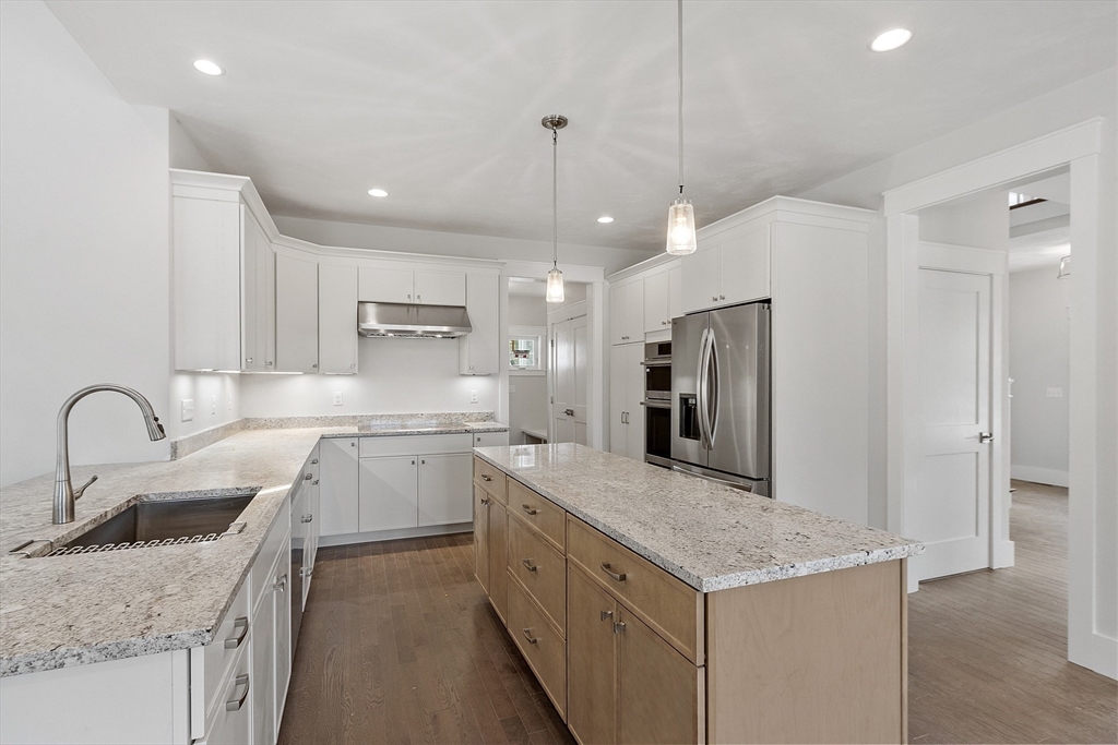22 Waites Crossing Norfolk, MA 02056 - Photo 7 of 33 a kitchen with a sink stove top oven and refrigerator