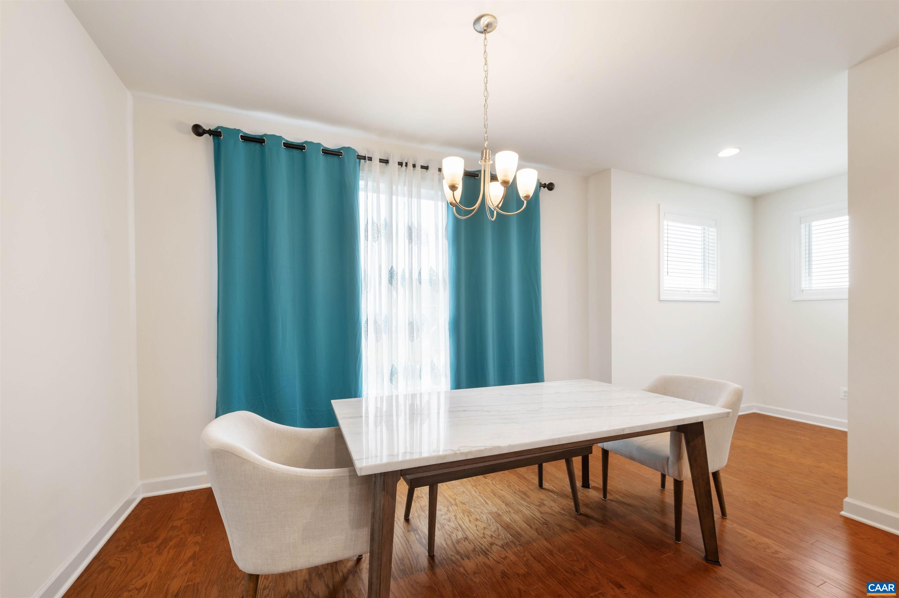 1670 Delphi Drive Charlottesville, VA 22911 - Photo 15 of 47 a view of a dining room with furniture window and wooden floor