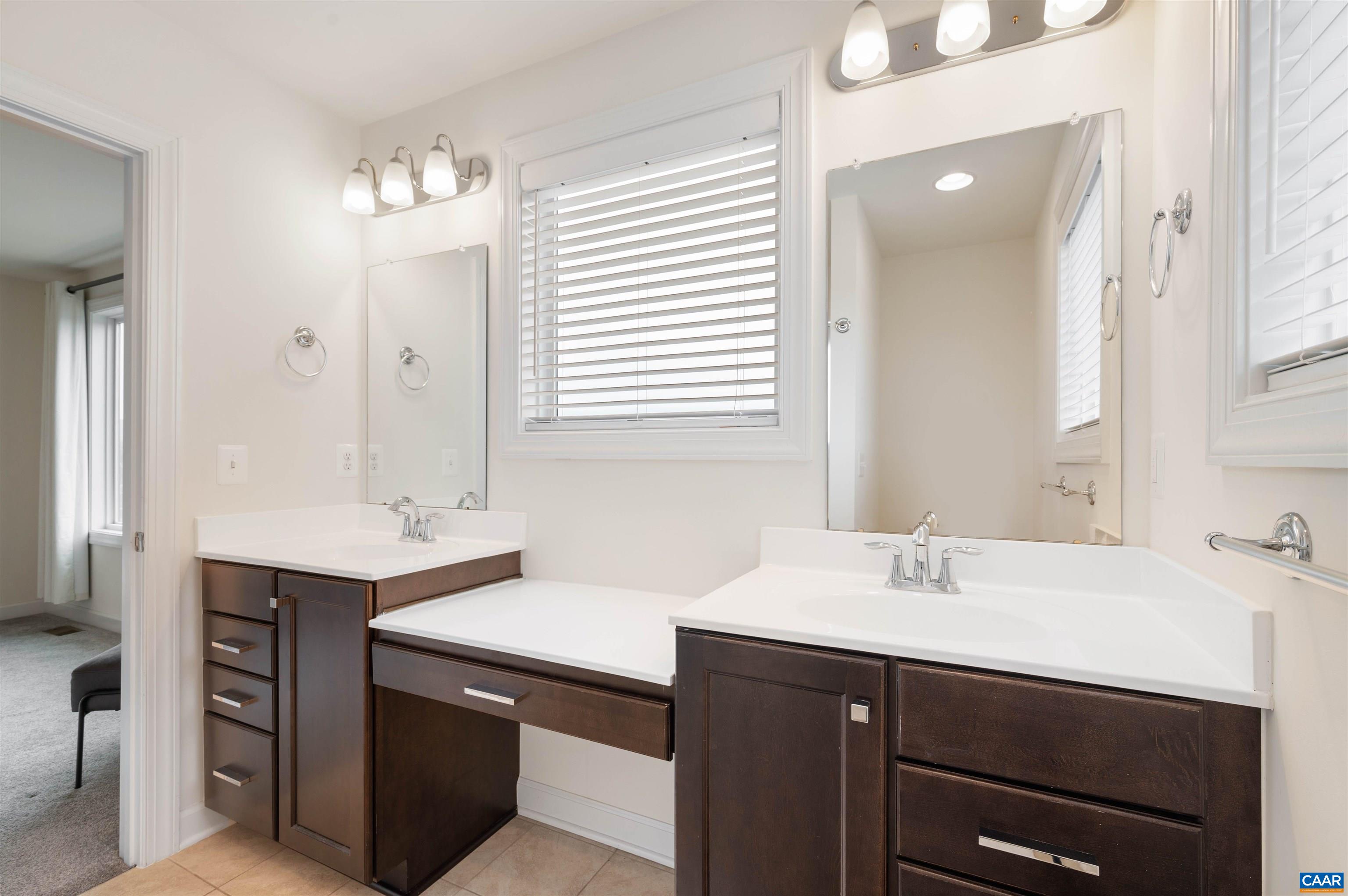 1670 Delphi Drive Charlottesville, VA 22911 - Photo 22 of 47 a bathroom with a sink double vanity and a mirror