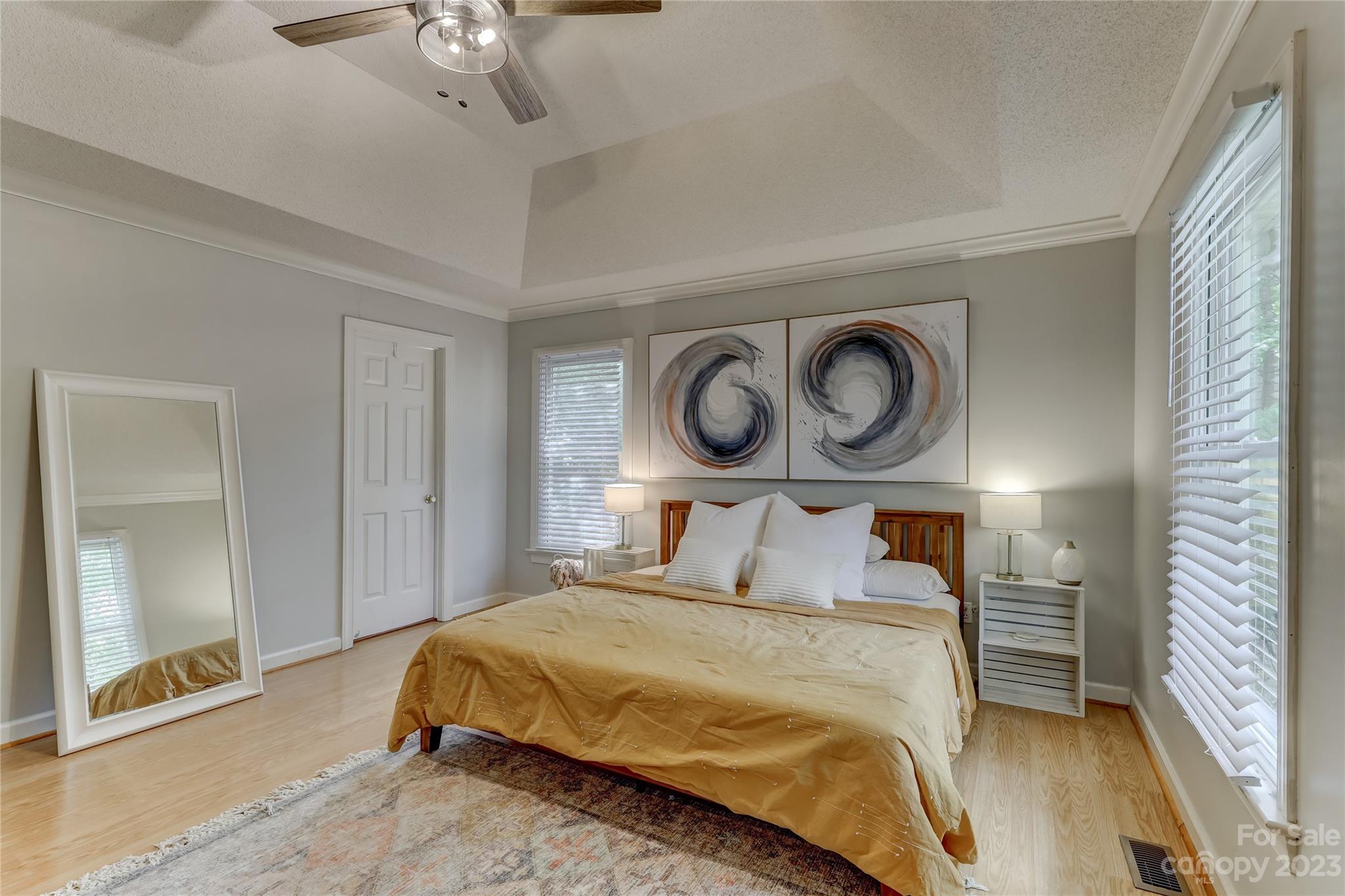 1631 Amanda Lane Rock Hill, SC 29730 - Photo 19 of 43 a bedroom with a bed and a chandelier