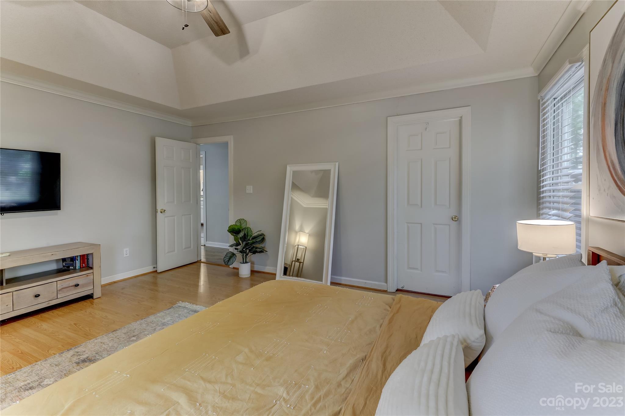 1631 Amanda Lane Rock Hill, SC 29730 - Photo 20 of 43 a bedroom with a bed and a flat tv screen on wall