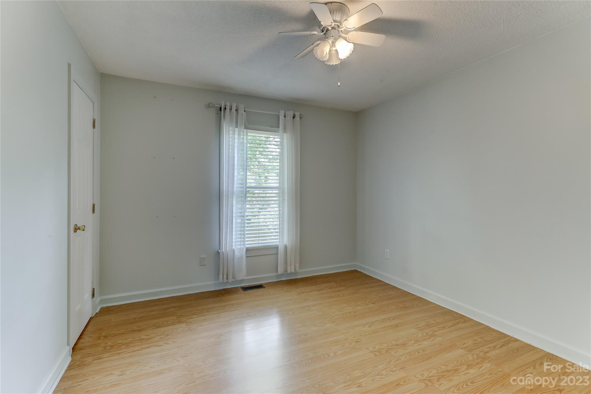 1631 Amanda Lane Rock Hill, SC 29730 - Photo 24 of 43 an empty room with a window and a fan