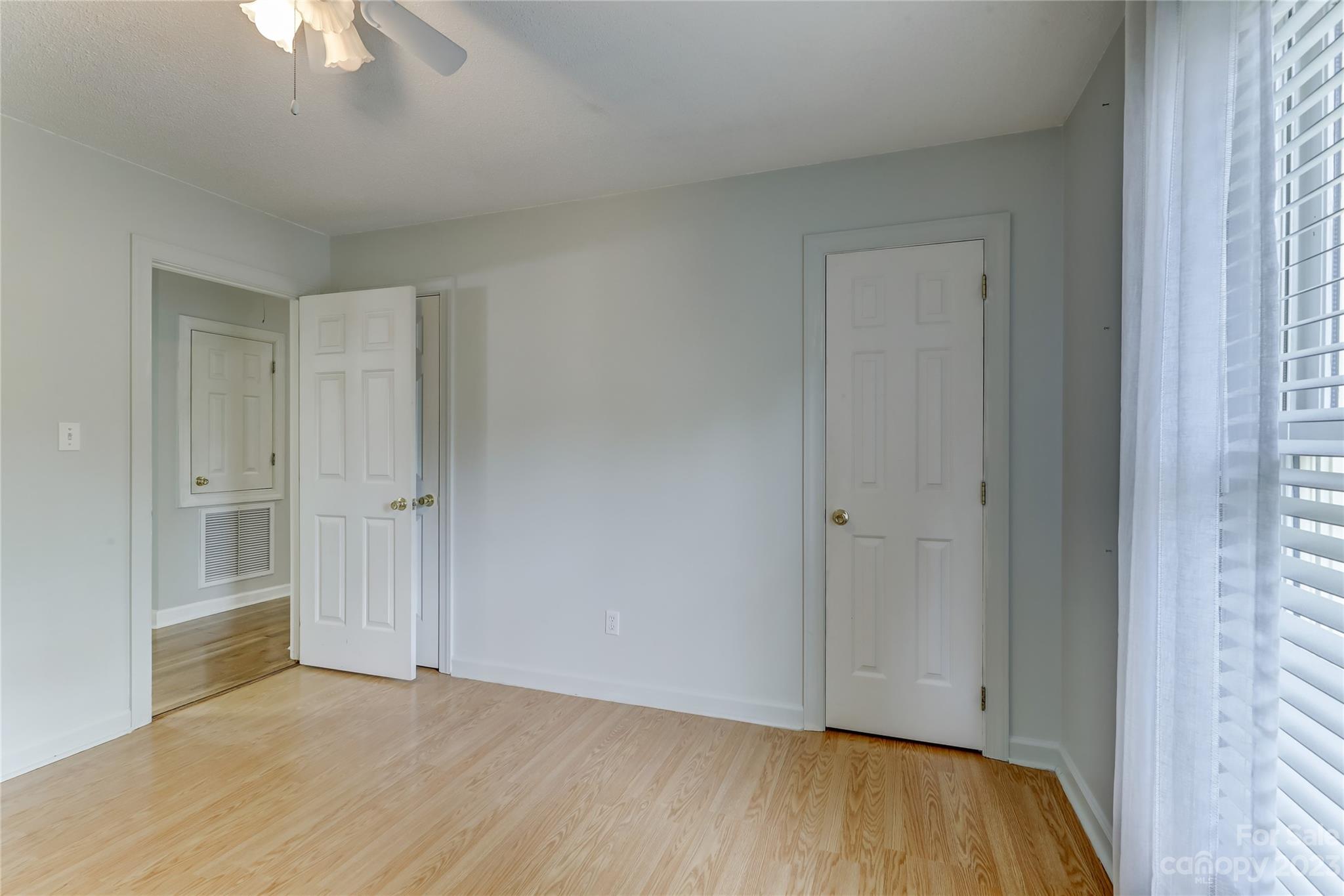 1631 Amanda Lane Rock Hill, SC 29730 - Photo 25 of 43 a view of an empty room with wooden floor and a window