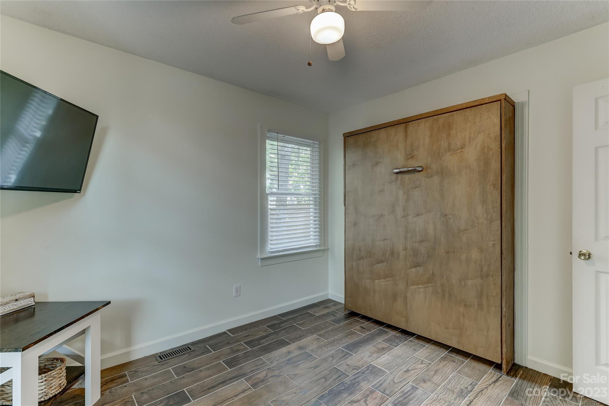 1631 Amanda Lane Rock Hill, SC 29730 - Photo 31 of 43 a view of an empty room with wooden floor and a window