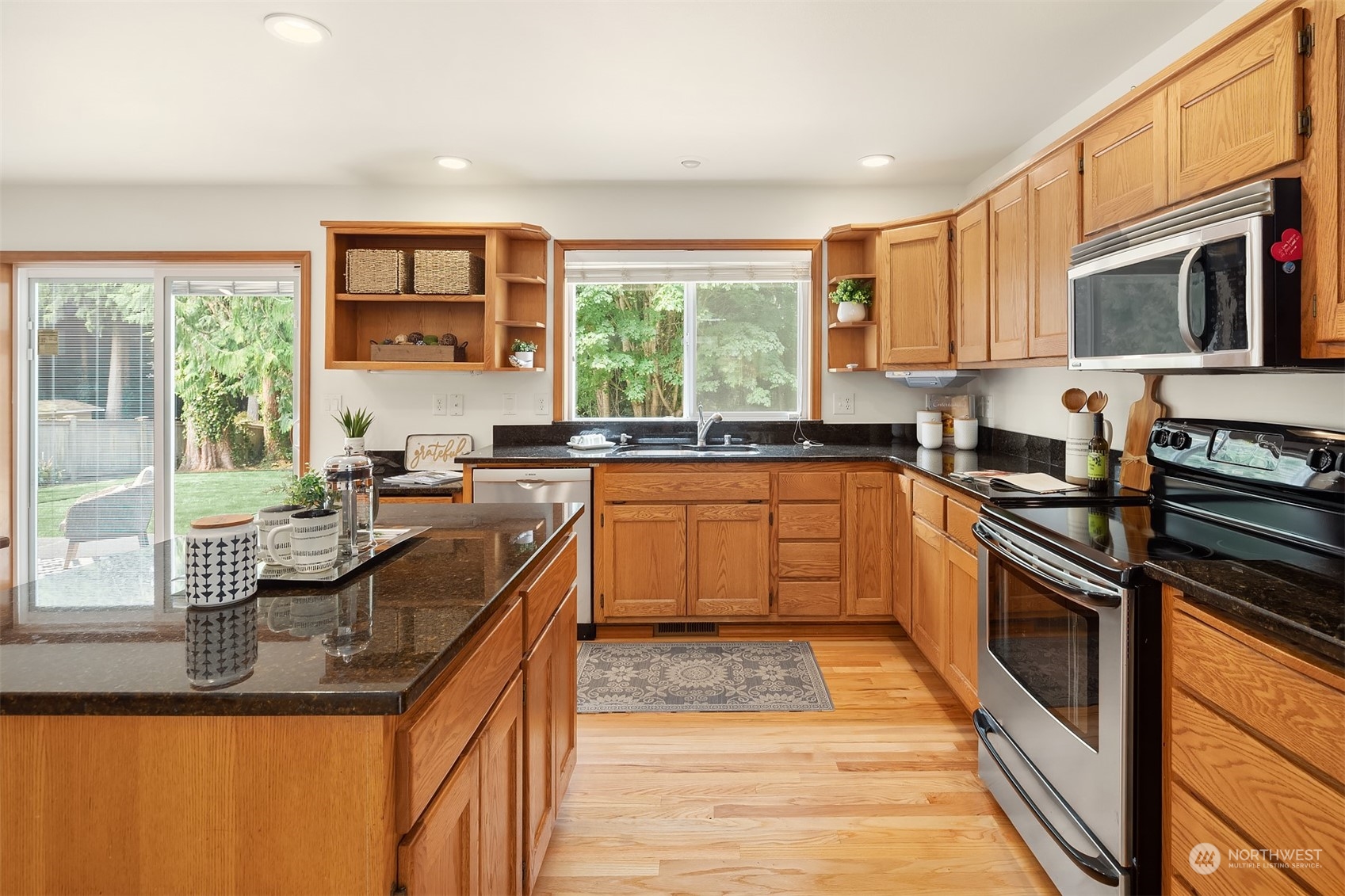 10818 27th Avenue Southeast Everett, WA 98208 - Photo 11 of 36 a kitchen with stainless steel appliances granite countertop a sink and stove