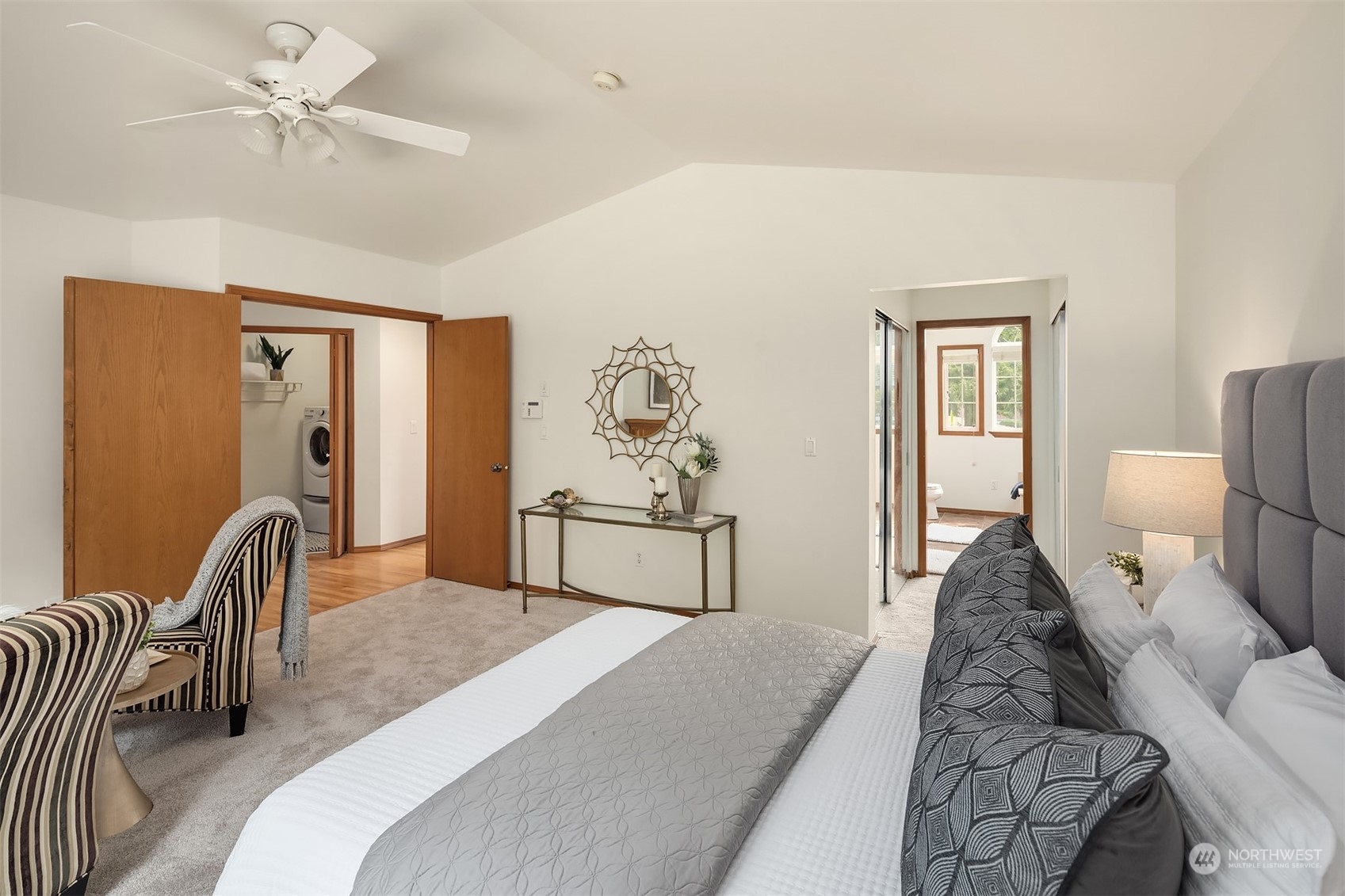 10818 27th Avenue Southeast Everett, WA 98208 - Photo 21 of 36 a bedroom with a bed couch and a chandelier