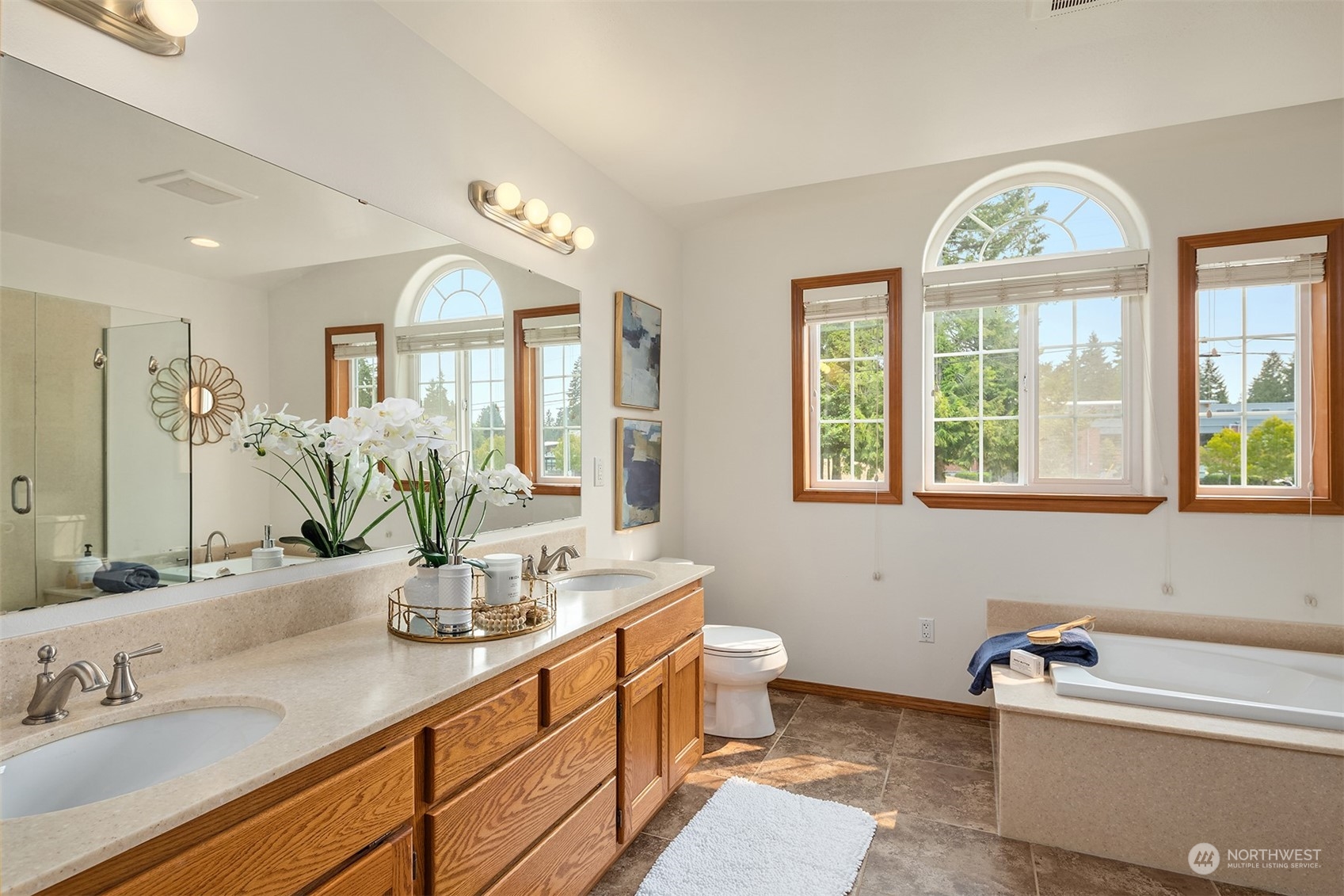 10818 27th Avenue Southeast Everett, WA 98208 - Photo 22 of 36 a bathroom with a granite countertop sink mirror and window