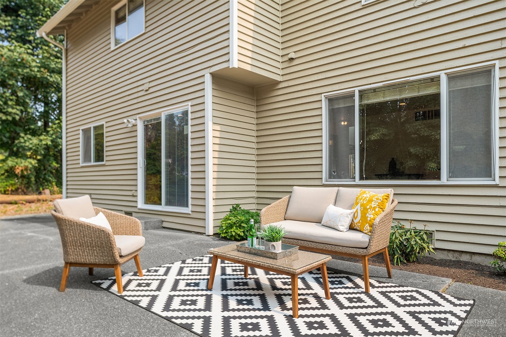 10818 27th Avenue Southeast Everett, WA 98208 - Photo 31 of 36 a view of a patio with couches table and chairs and potted plants
