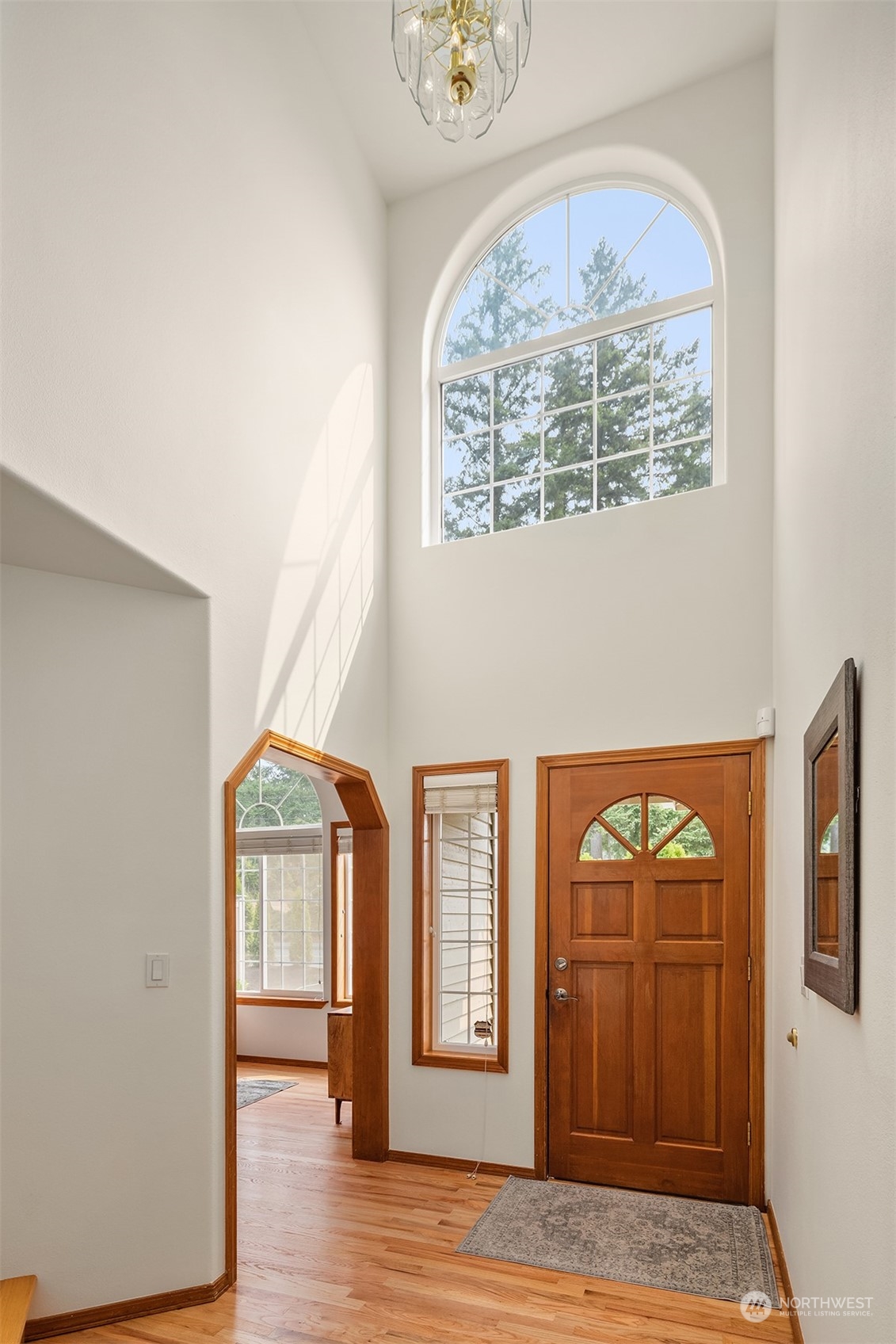 10818 27th Avenue Southeast Everett, WA 98208 - Photo 4 of 36 an empty room with wooden floor cabinet and a window