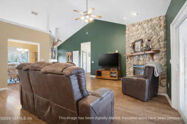 a spacious bathroom with a granite countertop sink a mirror and a shower