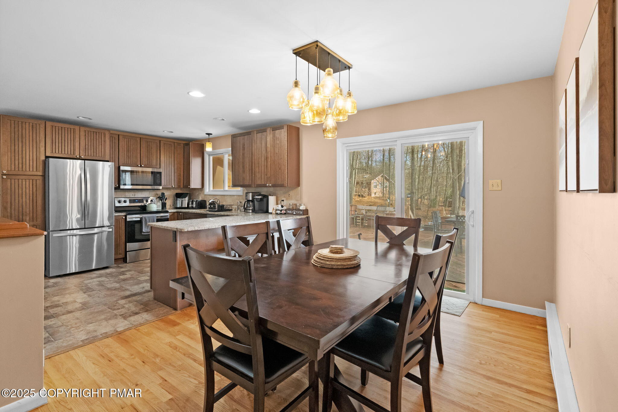 128 Winding Hill Road Pocono Pines, PA 18350 - Photo 14 of 77 a view of a dining room with furniture a chandelier and wooden floor