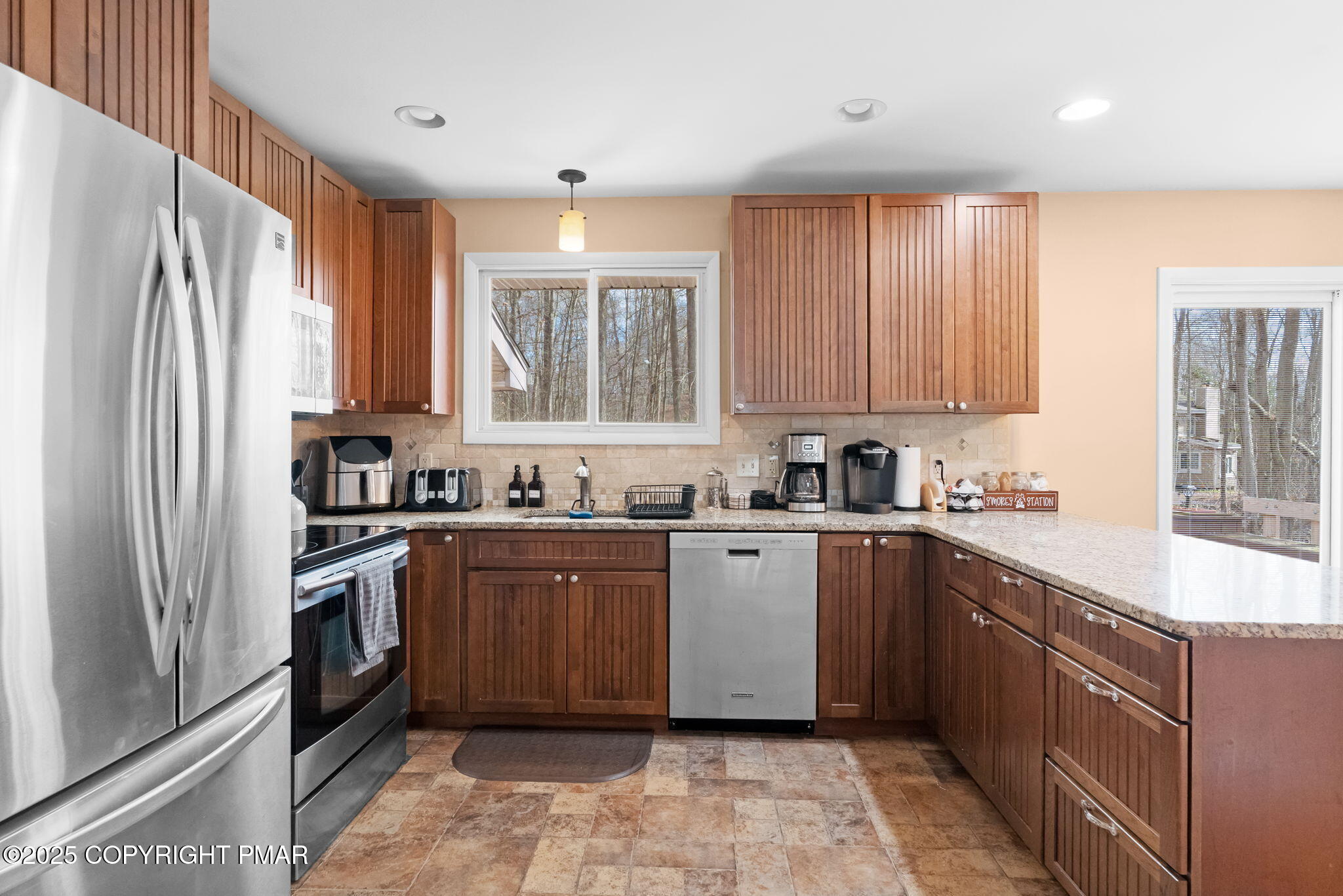 128 Winding Hill Road Pocono Pines, PA 18350 - Photo 20 of 77 a kitchen with stainless steel appliances granite countertop a refrigerator and wooden cabinets