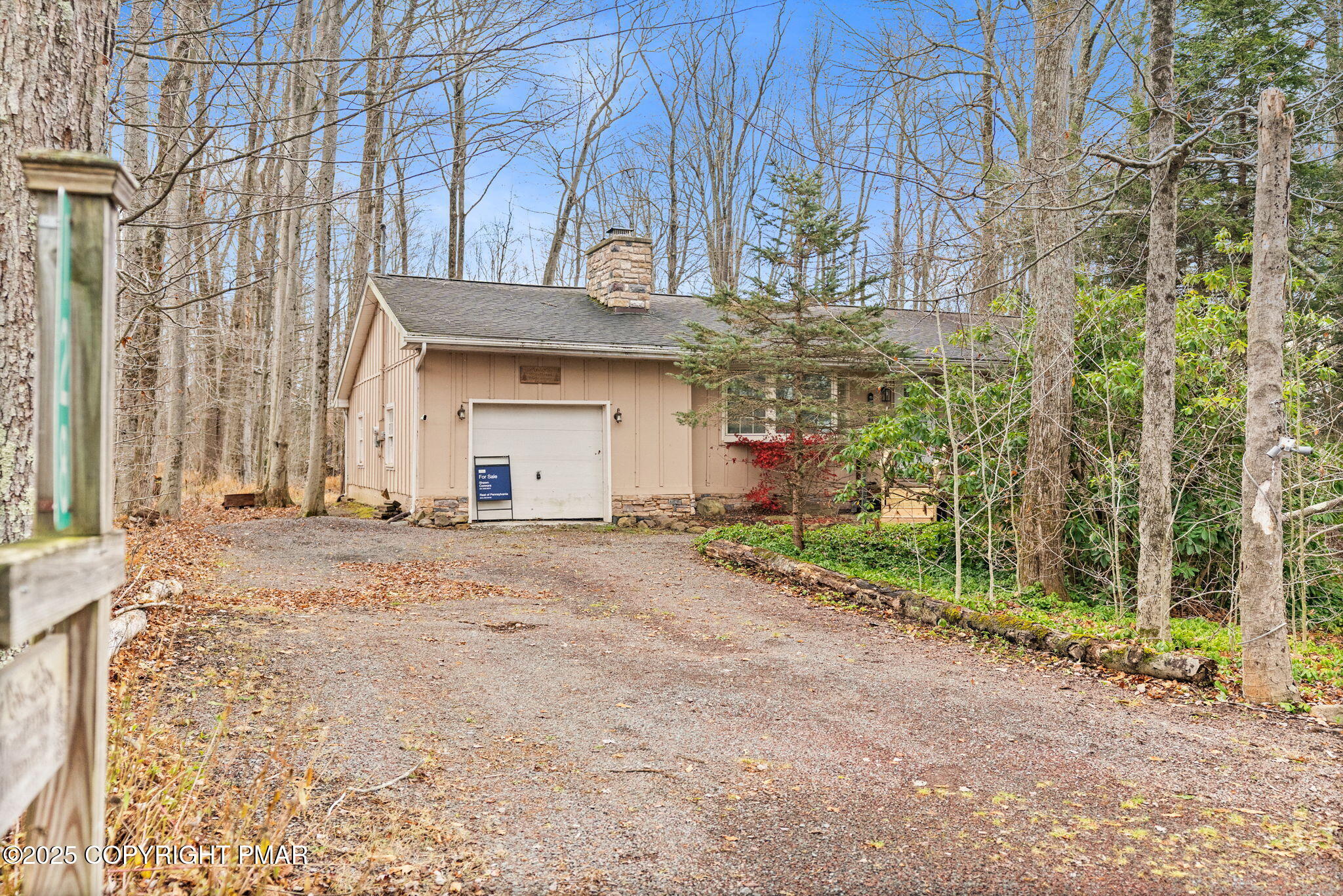 128 Winding Hill Road Pocono Pines, PA 18350 - Photo 2 of 77 a front view of a house with a yard and garage