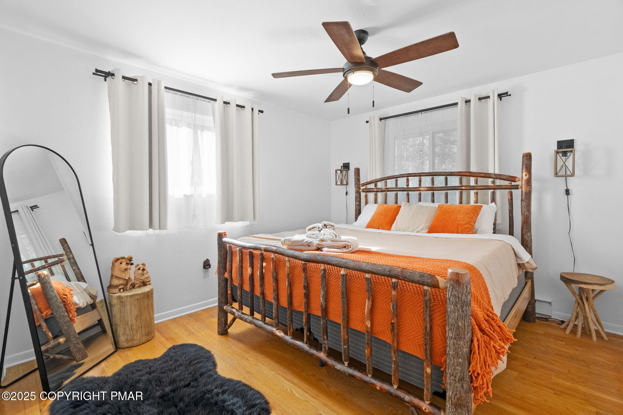 128 Winding Hill Road Pocono Pines, PA 18350 - Photo 27 of 77 a bed sitting in a bedroom next to a window