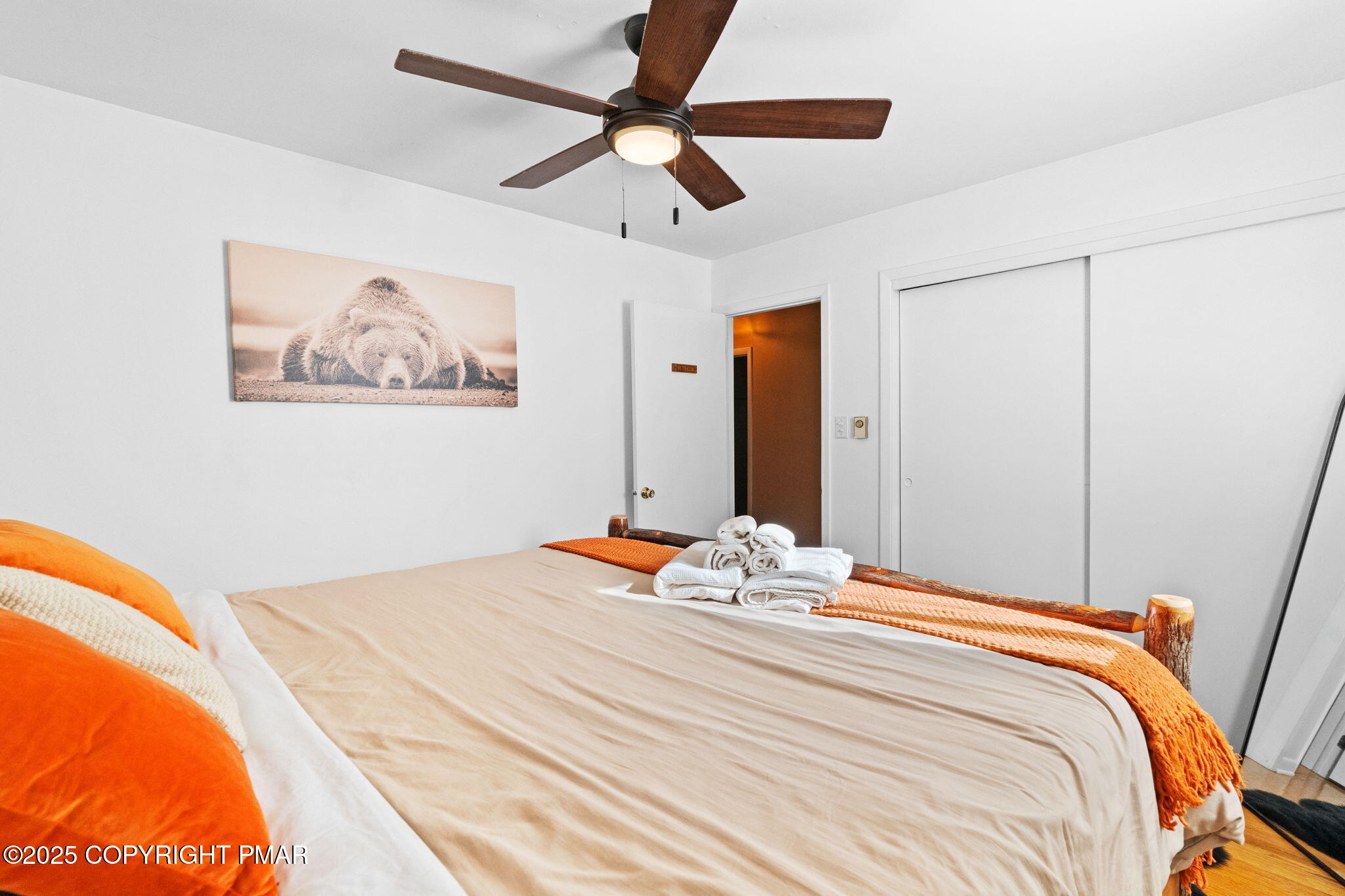 128 Winding Hill Road Pocono Pines, PA 18350 - Photo 29 of 77 a bedroom with a bed and a painting on the wall