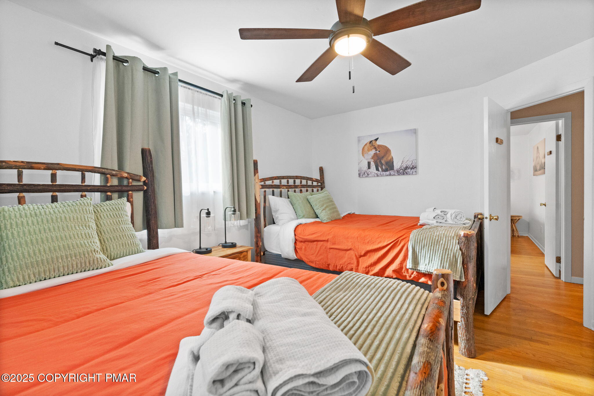 128 Winding Hill Road Pocono Pines, PA 18350 - Photo 32 of 77 a bedroom with a bed and a chandelier