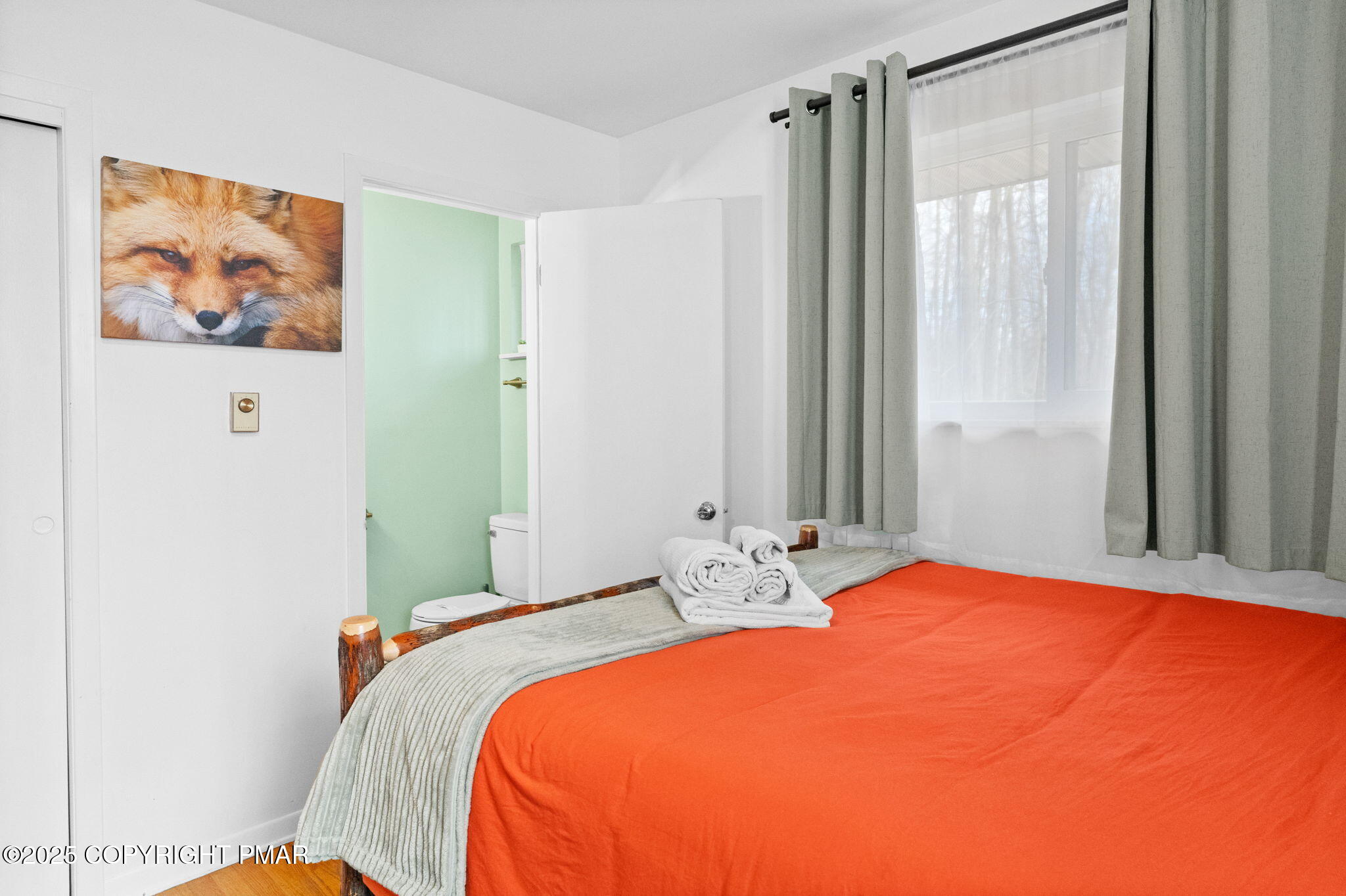 128 Winding Hill Road Pocono Pines, PA 18350 - Photo 33 of 77 a bedroom with a bed and a painting on the wall