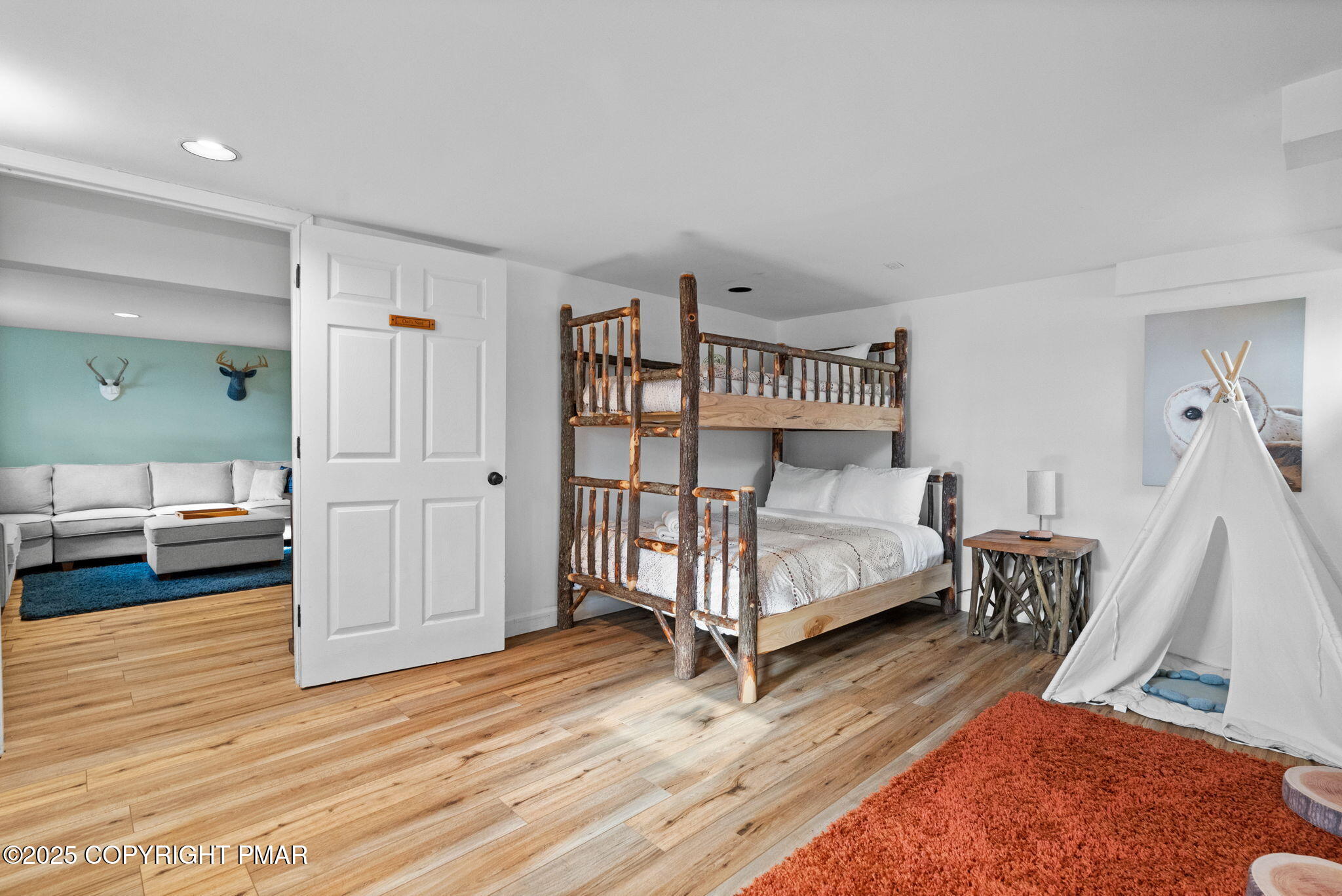 128 Winding Hill Road Pocono Pines, PA 18350 - Photo 39 of 77 a bedroom with a bed and a view of living room