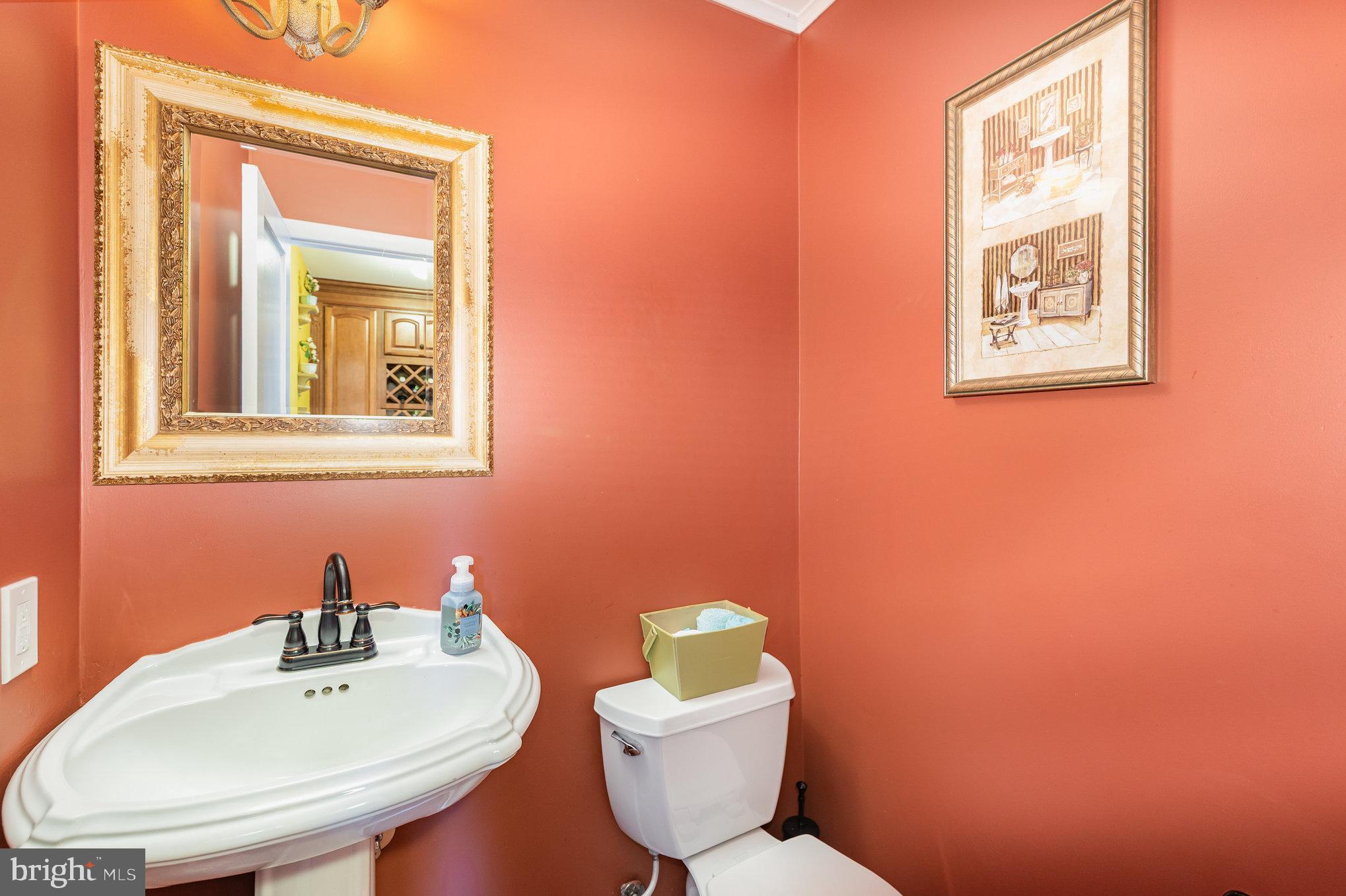 3827 Justin Road Monkton, MD 21111 - Photo 16 of 51 a bathroom with a toilet sink and mirror