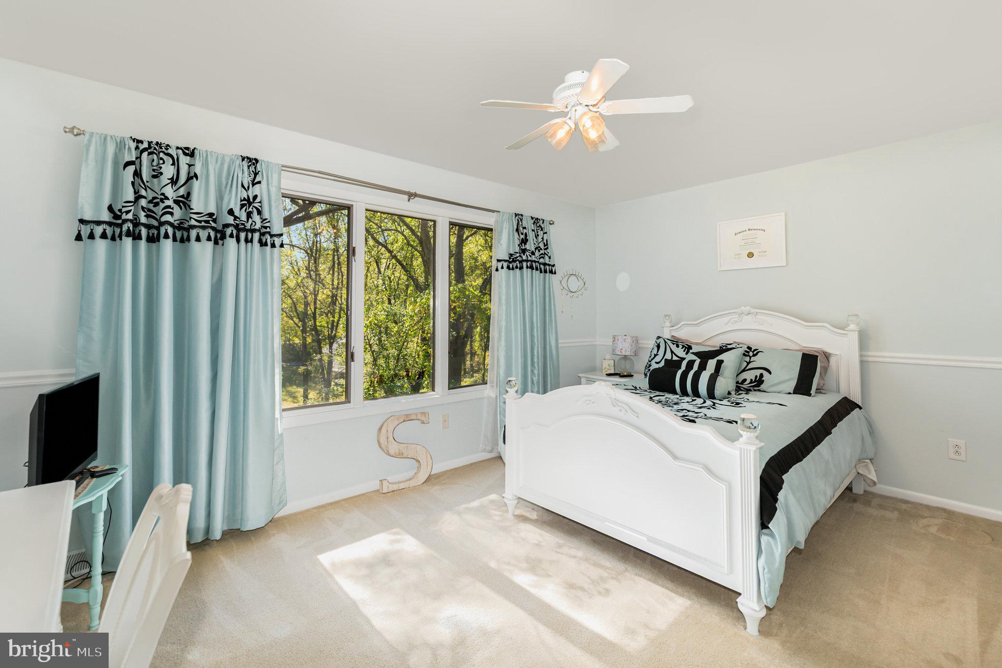 3827 Justin Road Monkton, MD 21111 - Photo 19 of 51 a white bed sitting in a bedroom next to a window