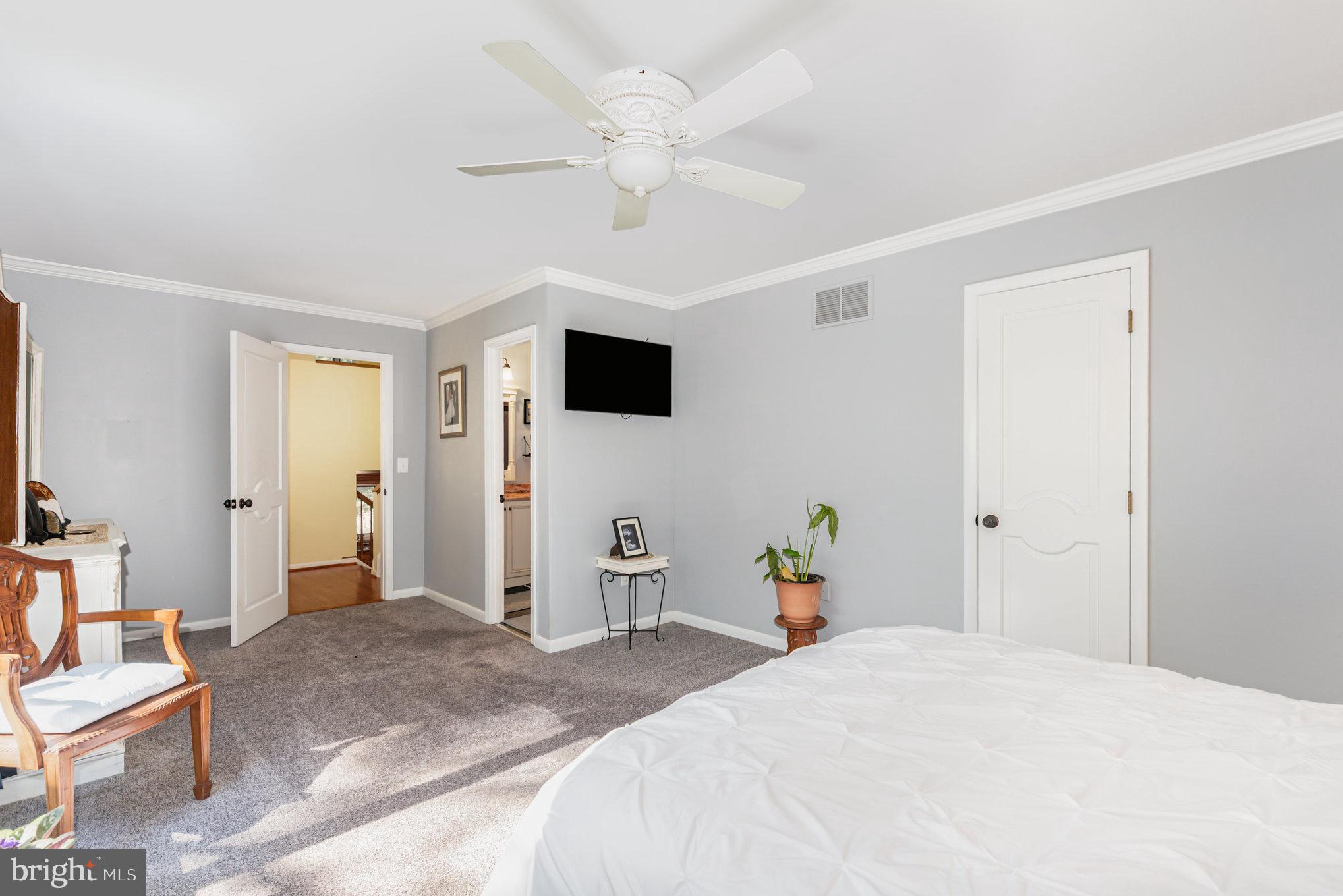 3827 Justin Road Monkton, MD 21111 - Photo 23 of 51 a bedroom with a bed and a chandelier