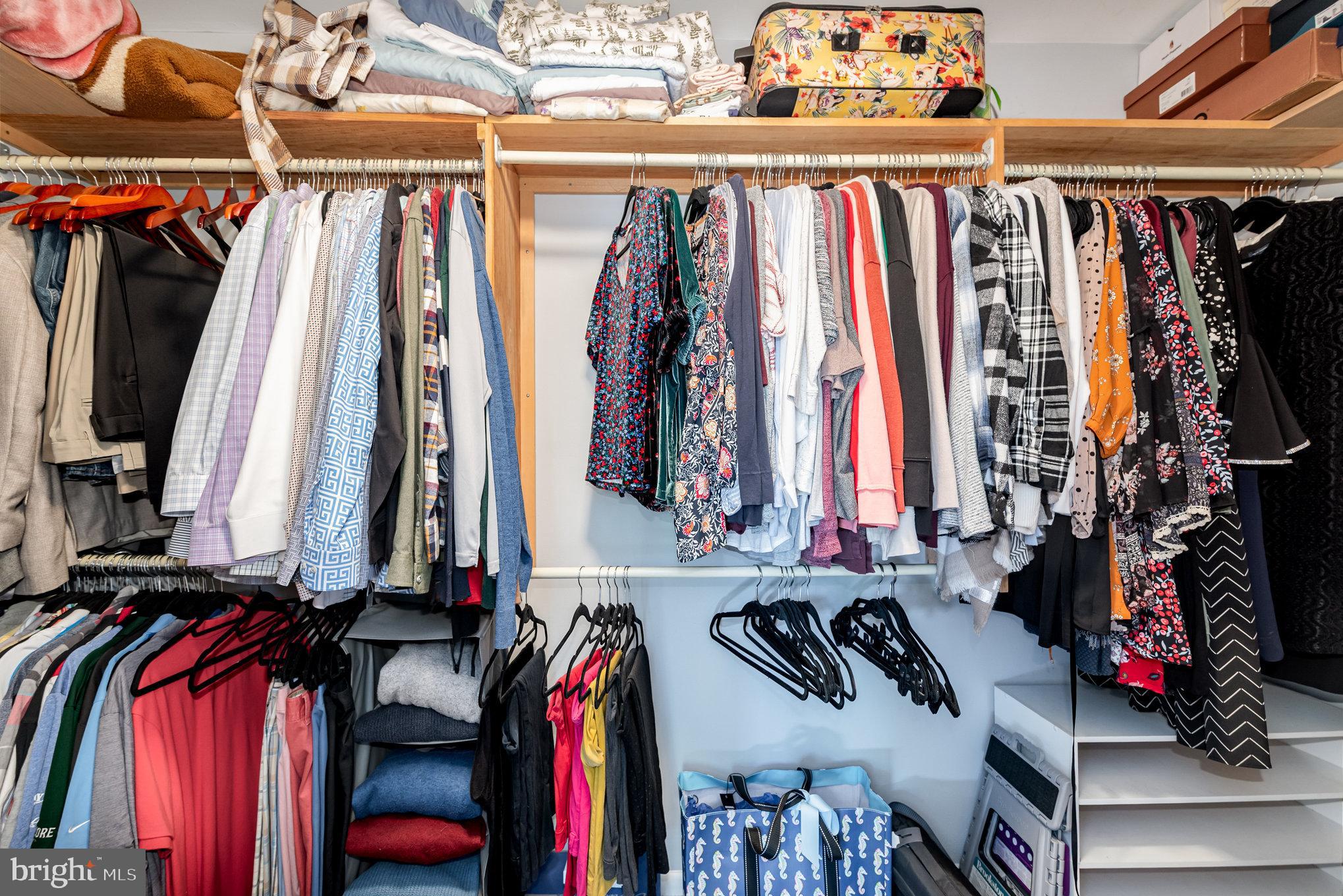 3827 Justin Road Monkton, MD 21111 - Photo 26 of 51 a view of walk in closet with clothes and shoes