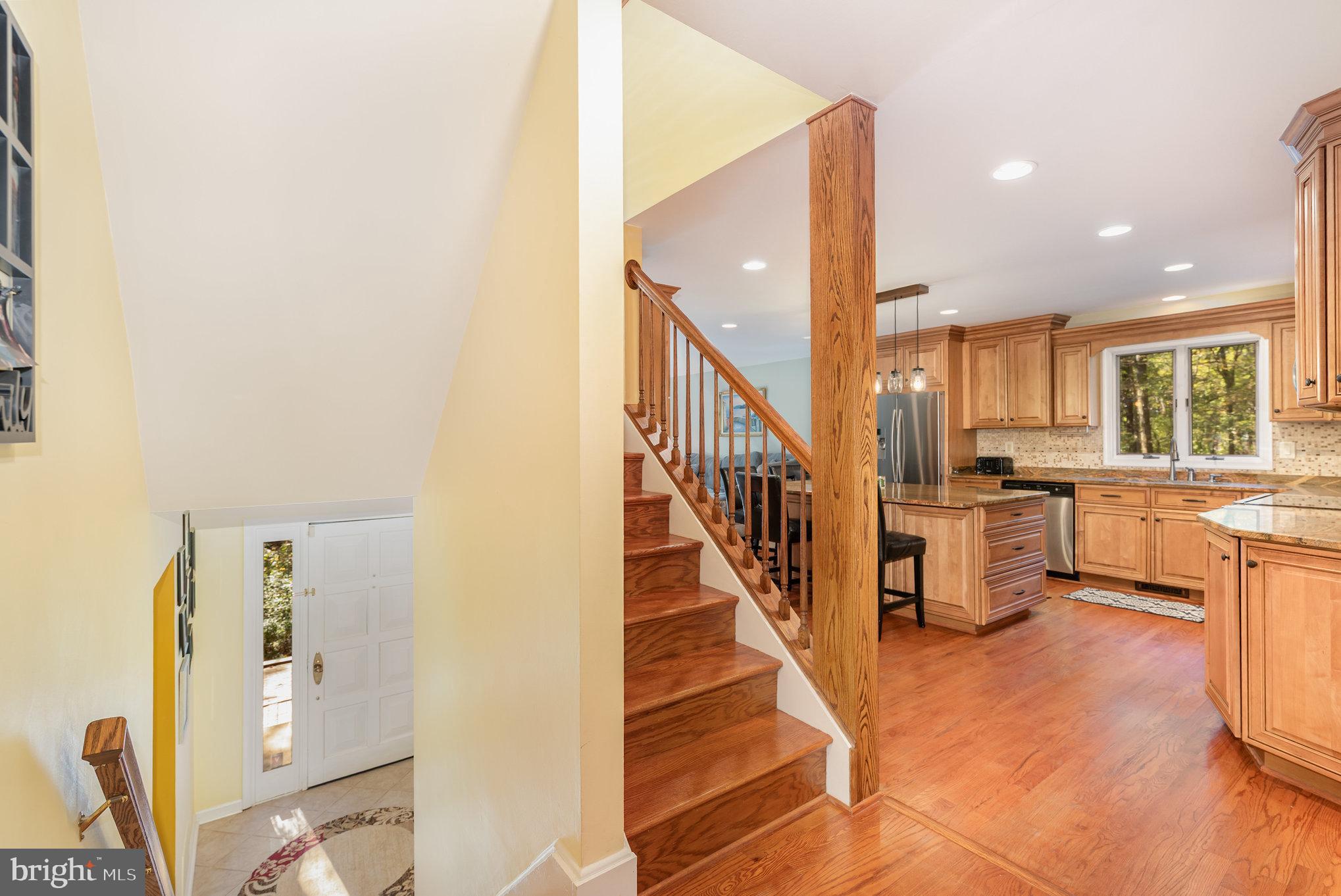 3827 Justin Road Monkton, MD 21111 - Photo 4 of 51 a view of a kitchen with furniture and staircase