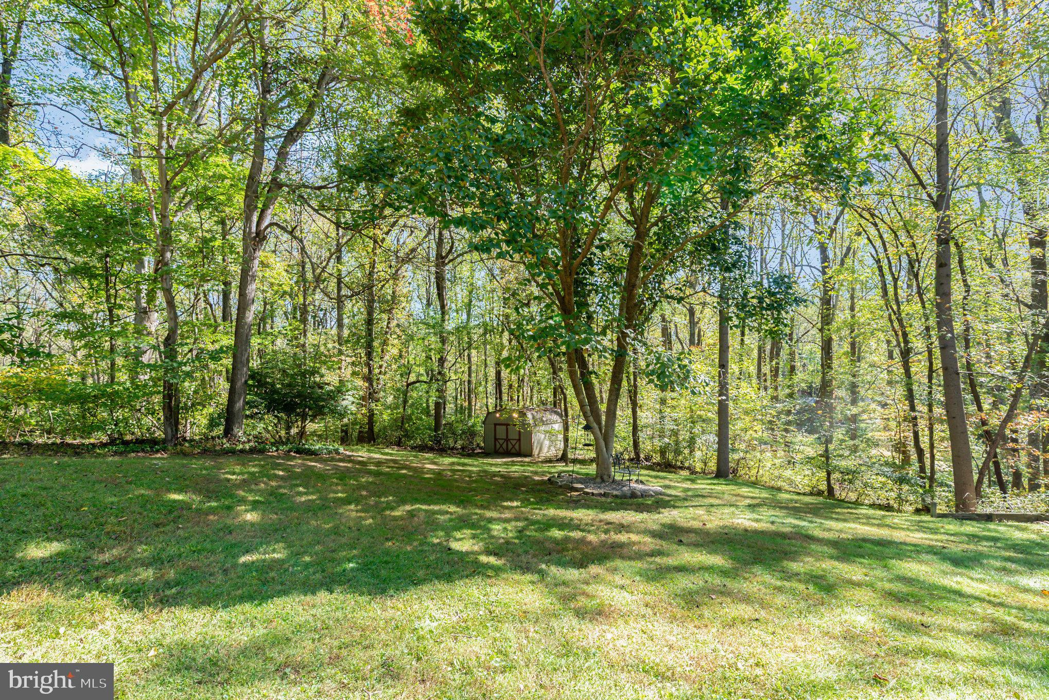 3827 Justin Road Monkton, MD 21111 - Photo 41 of 51 a backyard of apartments with large trees