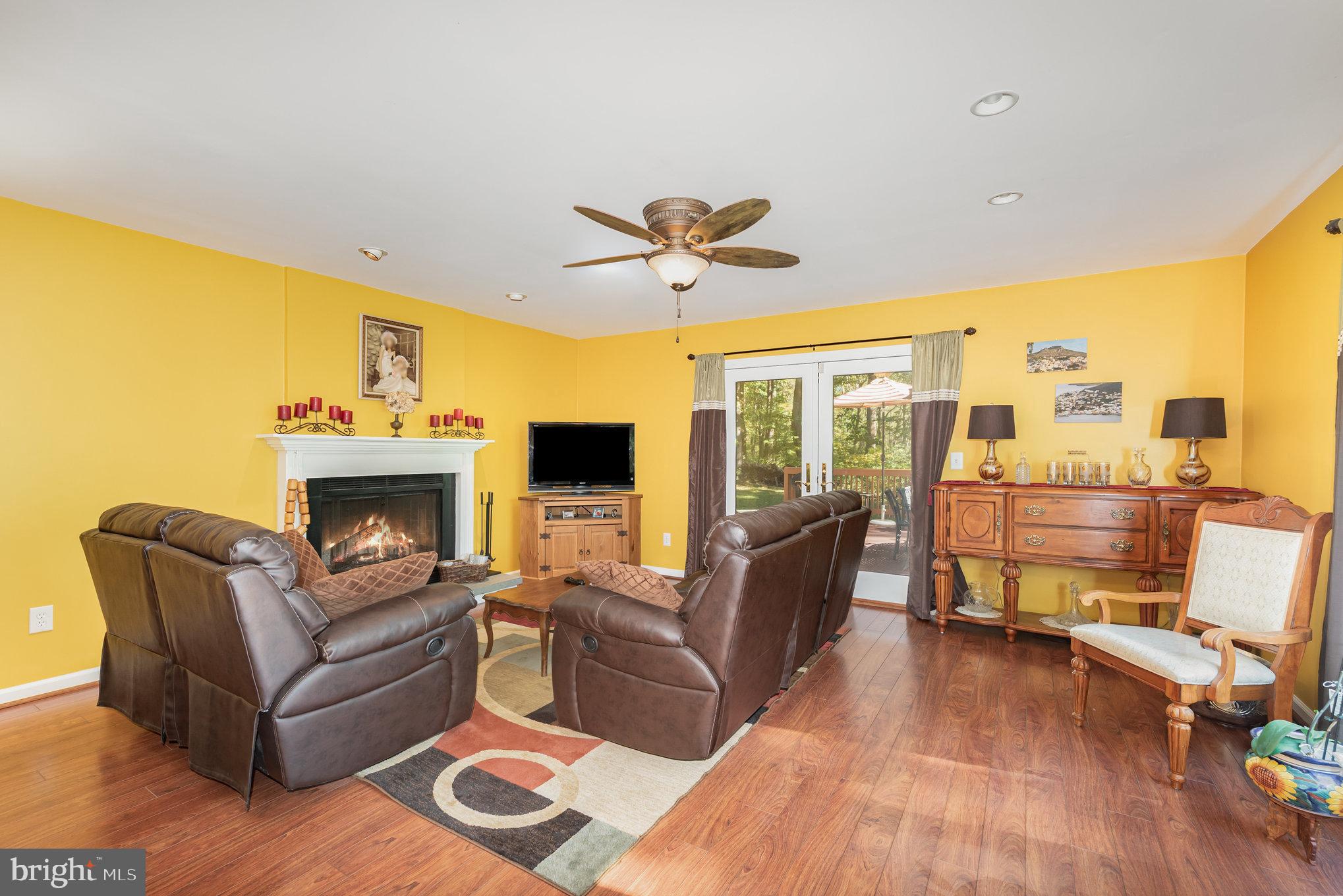 3827 Justin Road Monkton, MD 21111 - Photo 6 of 51 a living room with furniture and a fireplace