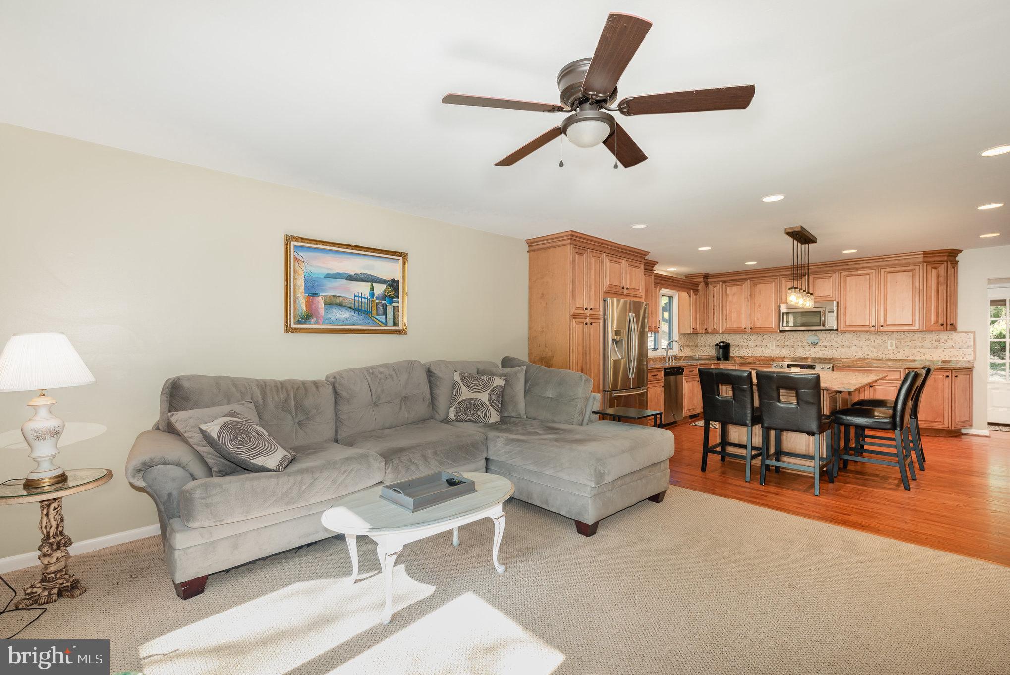 3827 Justin Road Monkton, MD 21111 - Photo 9 of 51 a living room with furniture and a dining table with kitchen view