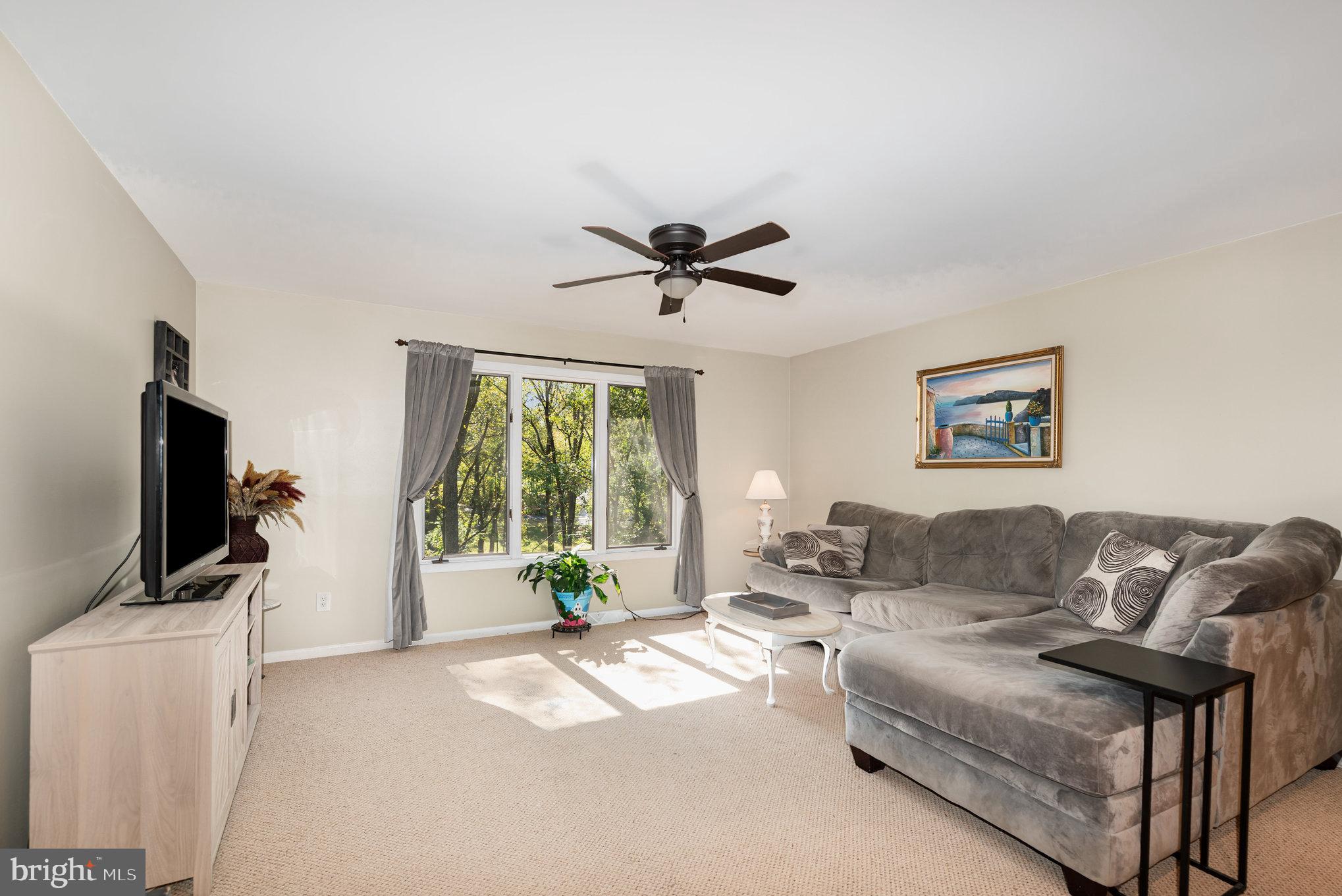 3827 Justin Road Monkton, MD 21111 - Photo 10 of 51 a living room with furniture and a flat screen tv
